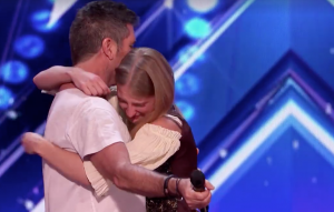 Simon Cowel giving Sara Carson a Hug on AGT