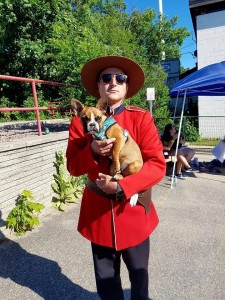 The adorable Harlow with a Canadian Mountie. Photo courtesy of @the_harlow